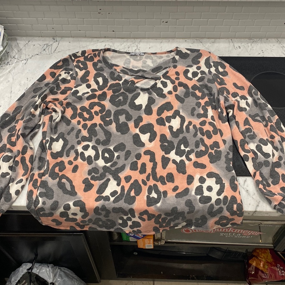 white birch low cut criss cross neck cheetah print bell like sleeves